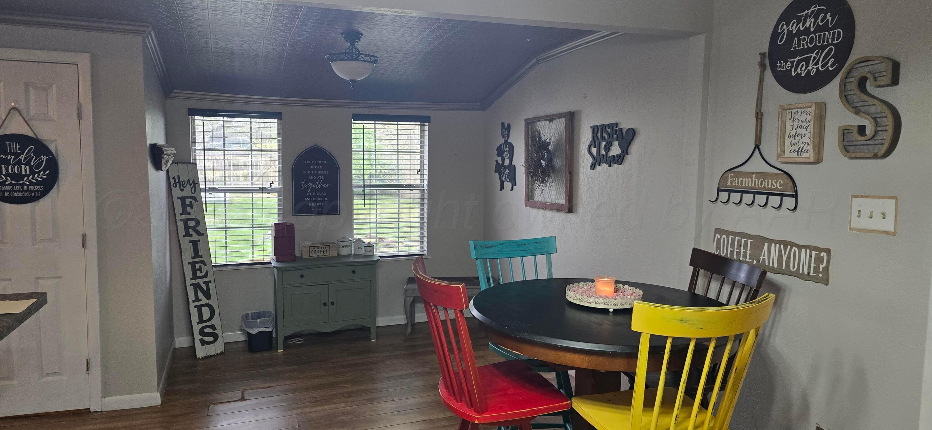 2115 Hemlock Street Borger, TX 79007 - Photo 12 of 43 a view of a dining room with furniture and wooden floor
