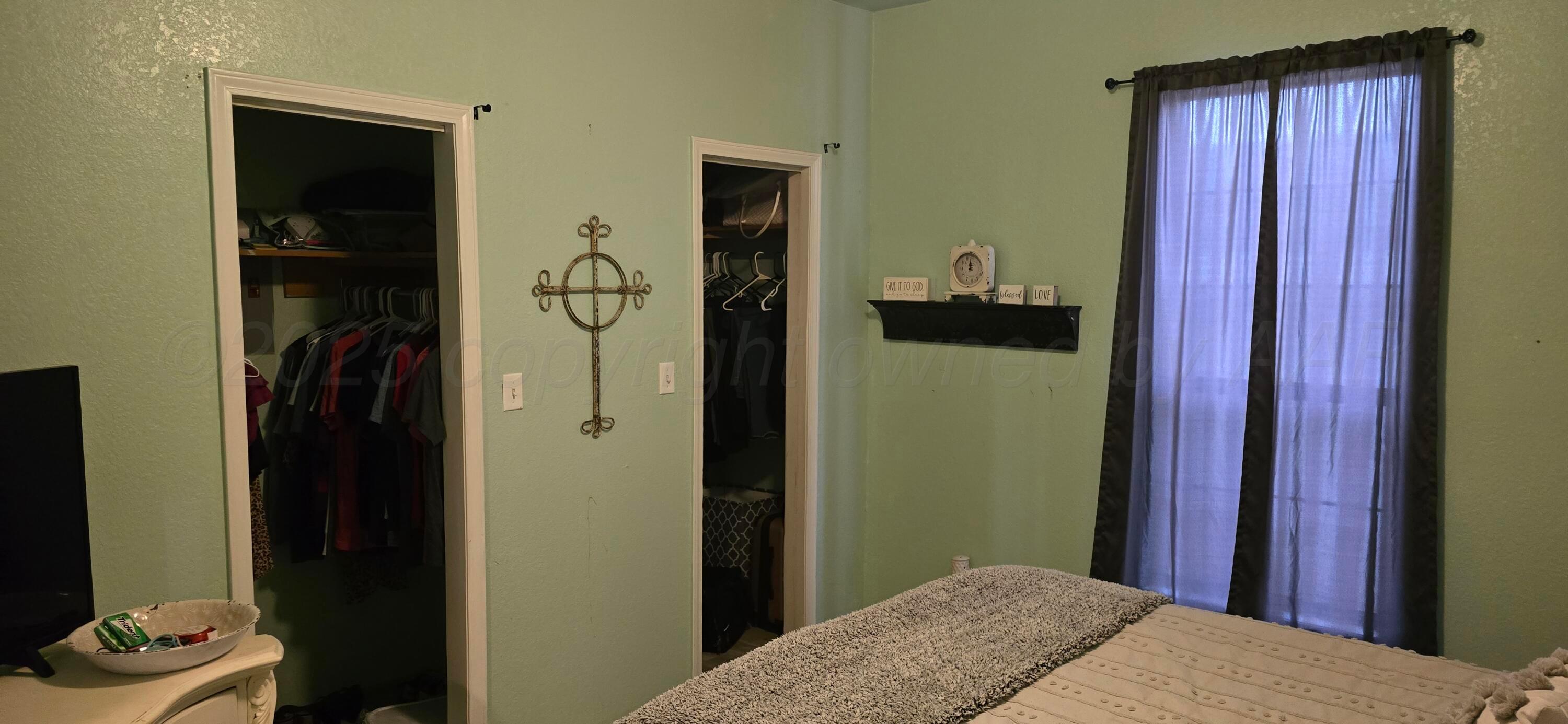 2115 Hemlock Street Borger, TX 79007 - Photo 14 of 43 a bedroom with a bed and a closet