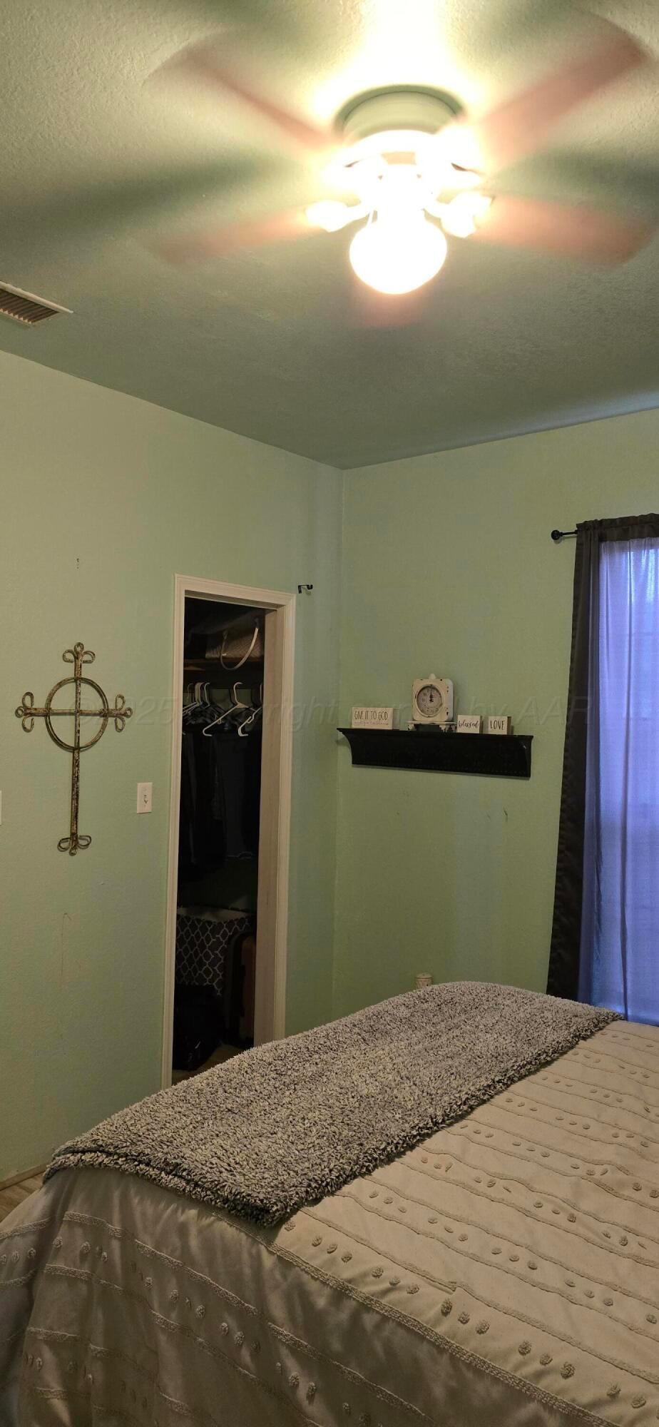 2115 Hemlock Street Borger, TX 79007 - Photo 15 of 43 a bedroom with closet and window