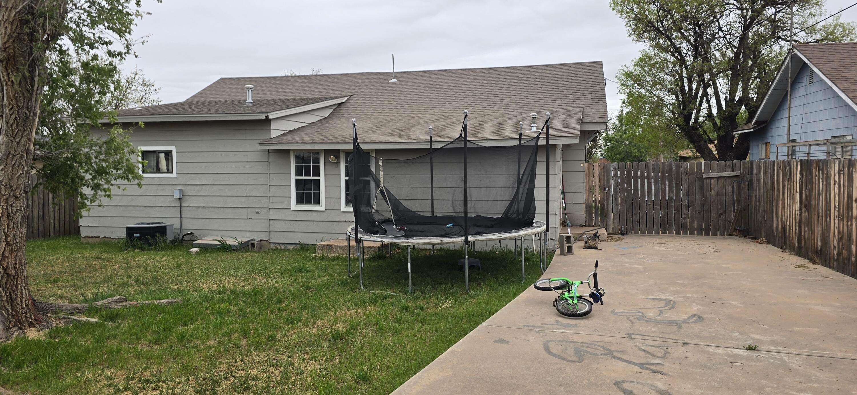 2115 Hemlock Street Borger, TX 79007 - Photo 30 of 43 a backyard of a house with barbeque oven