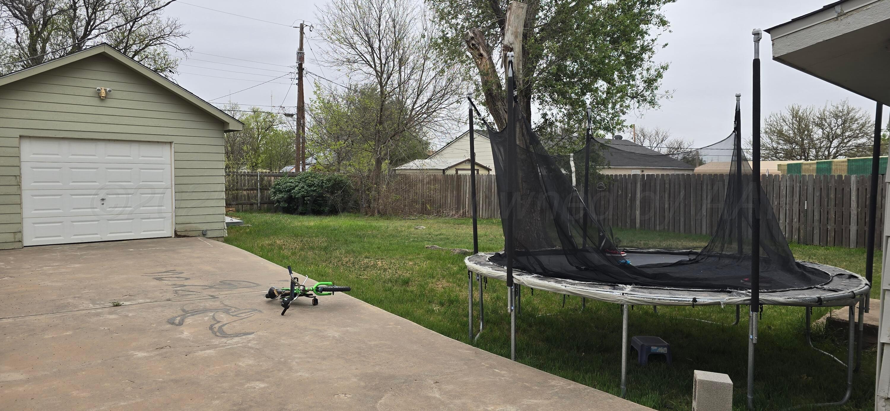 2115 Hemlock Street Borger, TX 79007 - Photo 31 of 43 a backyard of a house with trampoline