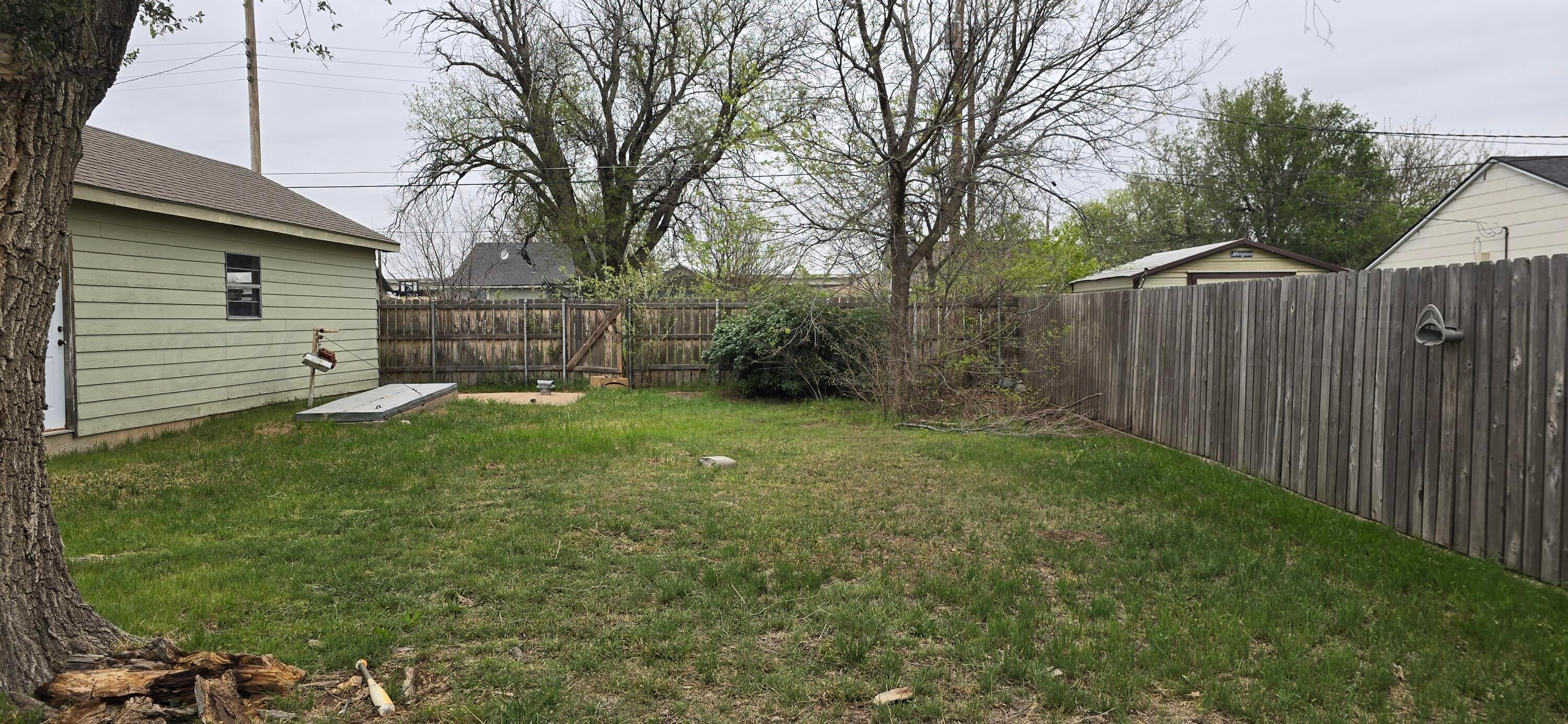 2115 Hemlock Street Borger, TX 79007 - Photo 32 of 43 a view of a backyard with a small cabin