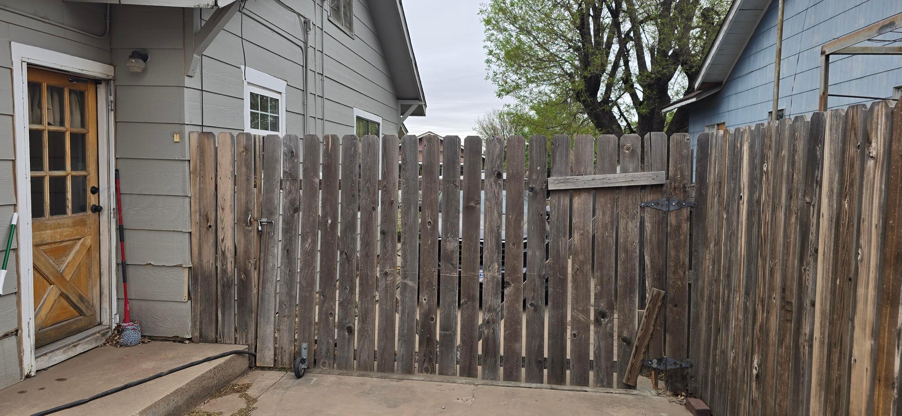 2115 Hemlock Street Borger, TX 79007 - Photo 42 of 43 a view of a wooden door with a wooden fence