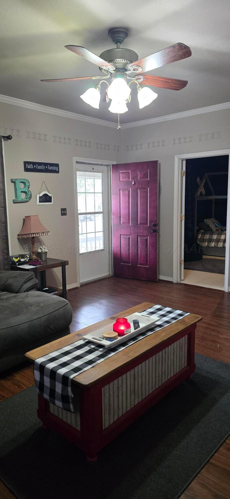 2115 Hemlock Street Borger, TX 79007 - Photo 6 of 43 a living room with furniture flat screen tv and a window