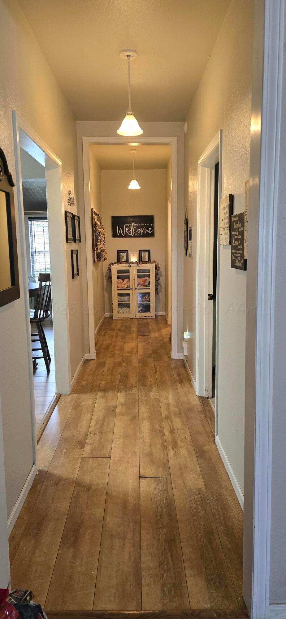 2115 Hemlock Street Borger, TX 79007 - Photo 8 of 43 a view of a kitchen with a sink and a refrigerator