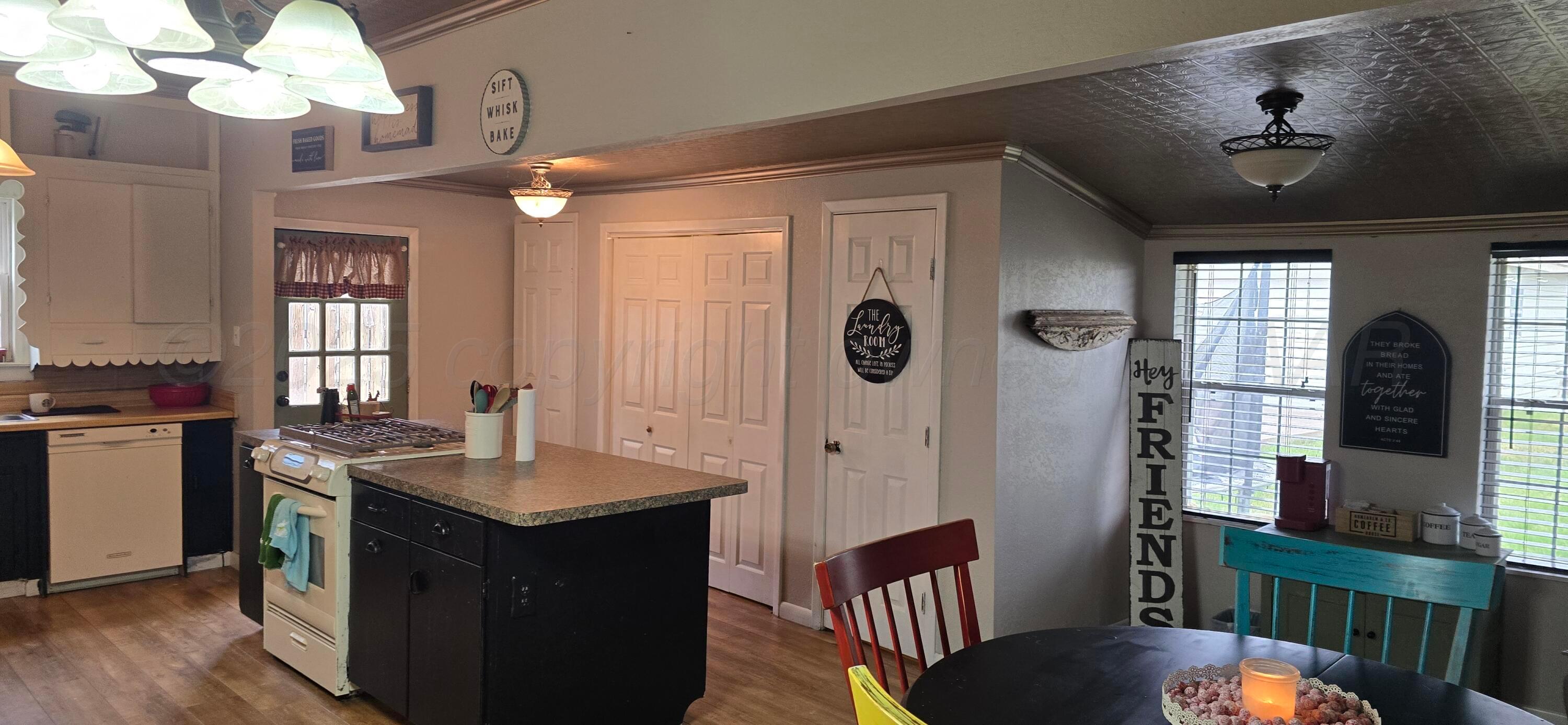 2115 Hemlock Street Borger, TX 79007 - Photo 9 of 43 a view of a kitchen and dining room