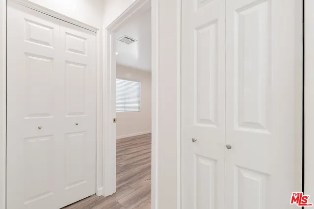a view of a bathroom from the hallway