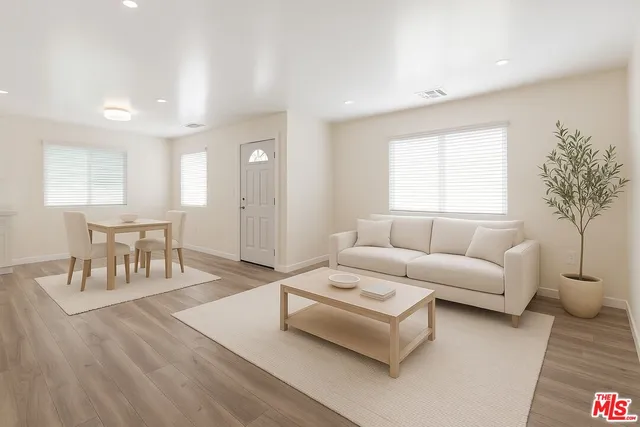 a living room with furniture and a table