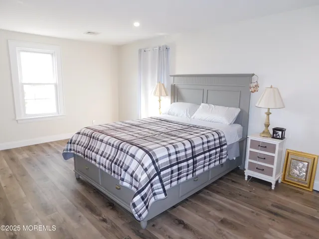 a bedroom with a bed and a cabinets