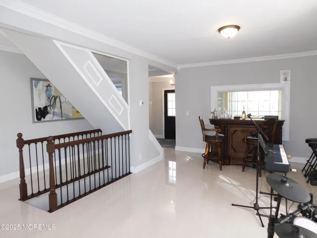 a view of a livingroom with furniture and windows
