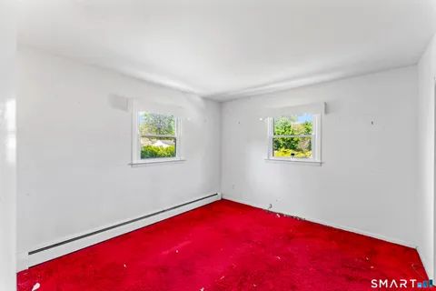 a view of empty room with floor to ceiling window
