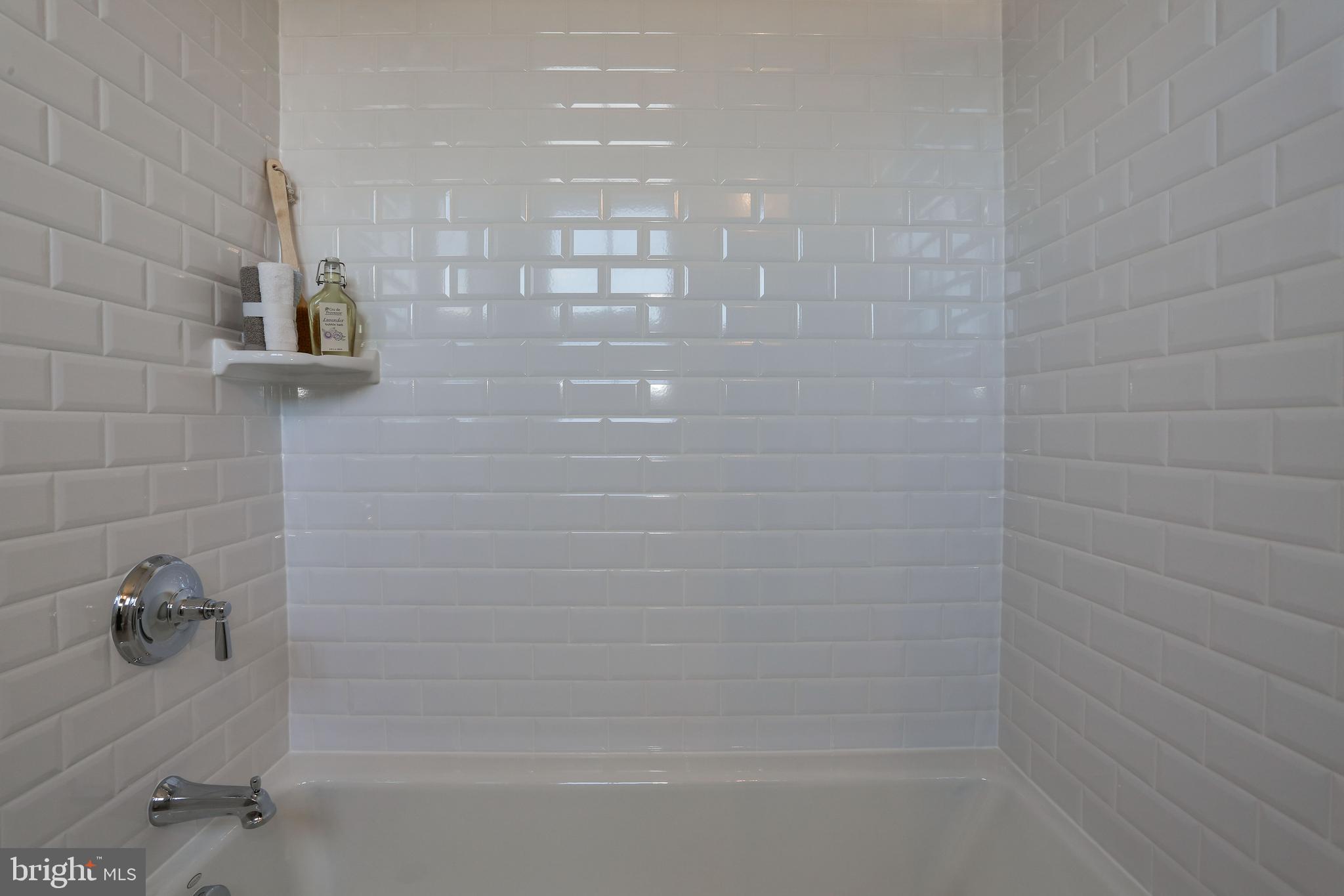 5010 25th Road North Arlington, VA 22207 - Photo 33 of 51 classic white tile at tub surround