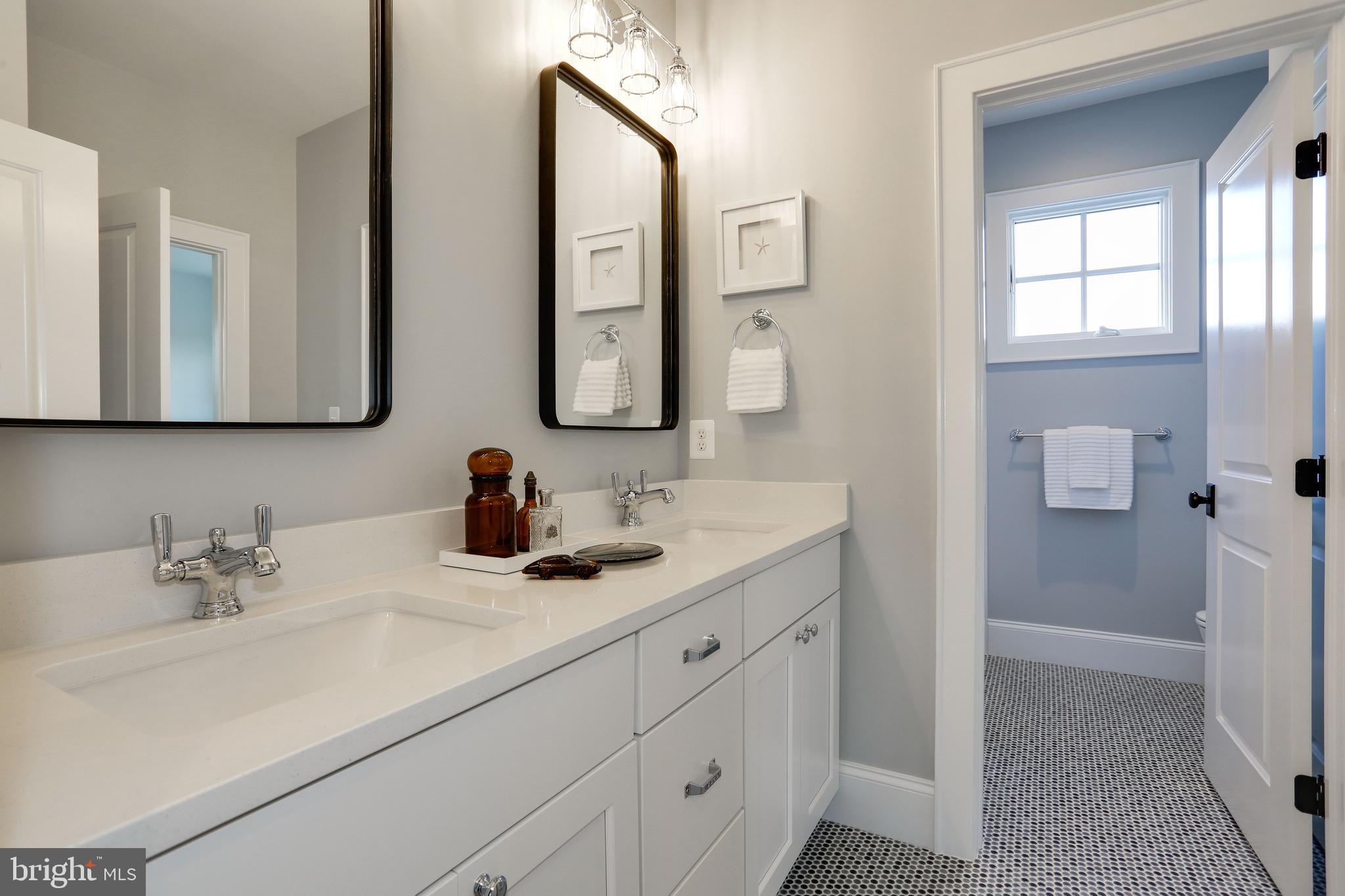 5010 25th Road North Arlington, VA 22207 - Photo 35 of 51 double vanity in shared bathroom, penny tile floor