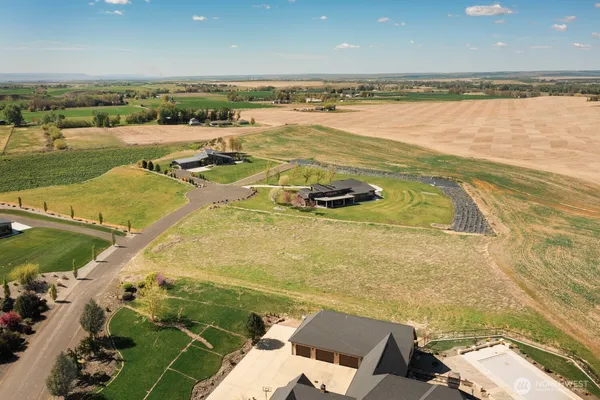 an aerial view of a house with beach