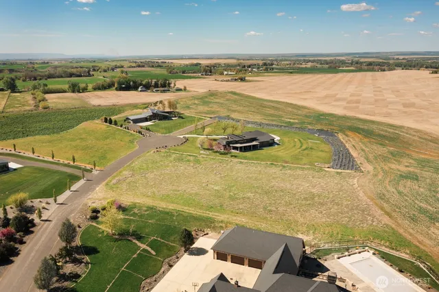 an aerial view of a house with beach