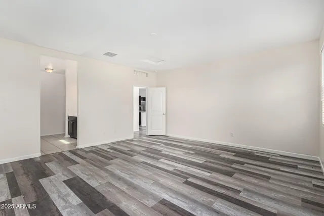 a view of a livingroom with wooden floor and closet
