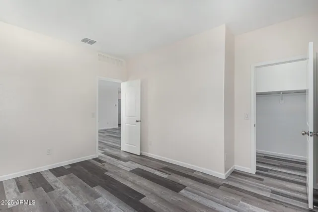 an empty room with wooden floor