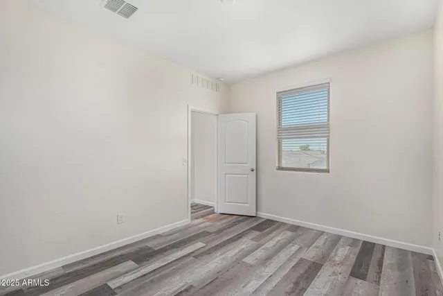 a view of room with window and closet