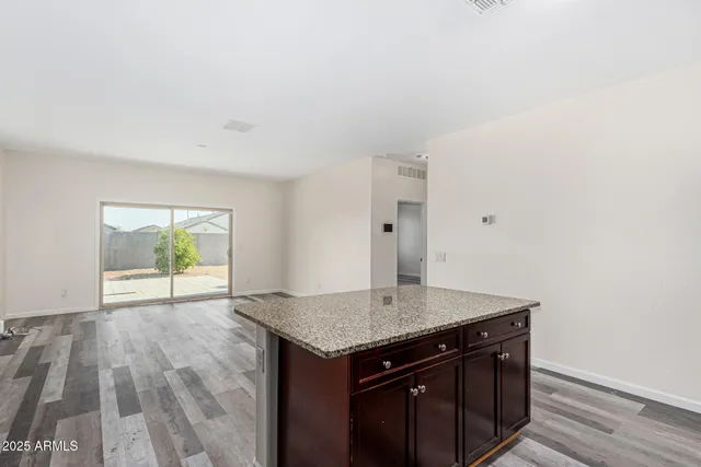 a view of wooden floor and a sink in a room