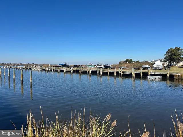 a kitchen with a sink stove top oven and microwave