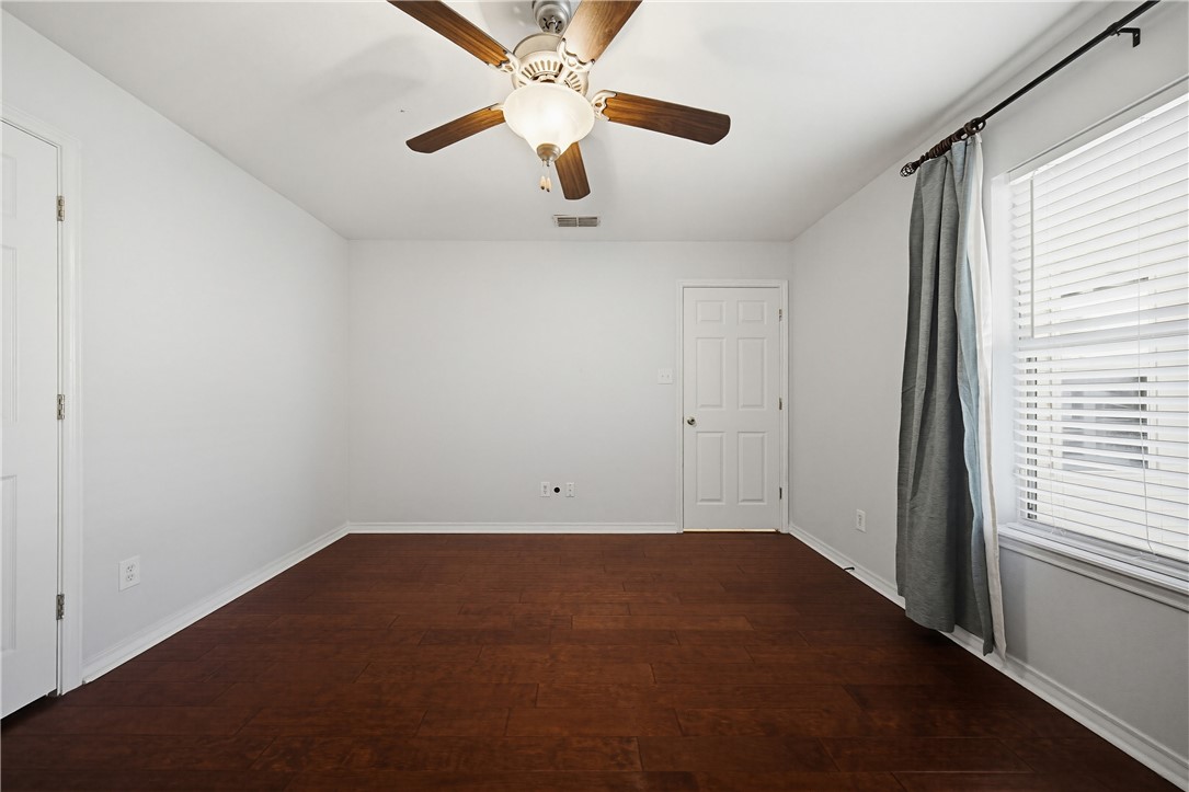 7251 Prairie Drive, Unit 6 Corpus Christi, TX 78413 - Photo 16 of 28 an empty room with a window and a fan