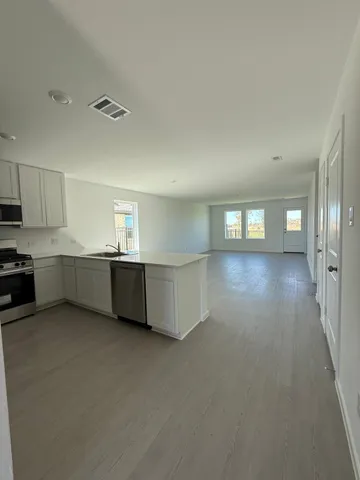 a view of a kitchen with kitchen and a sink