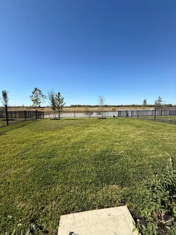 a view of a large body of water with a building in the background