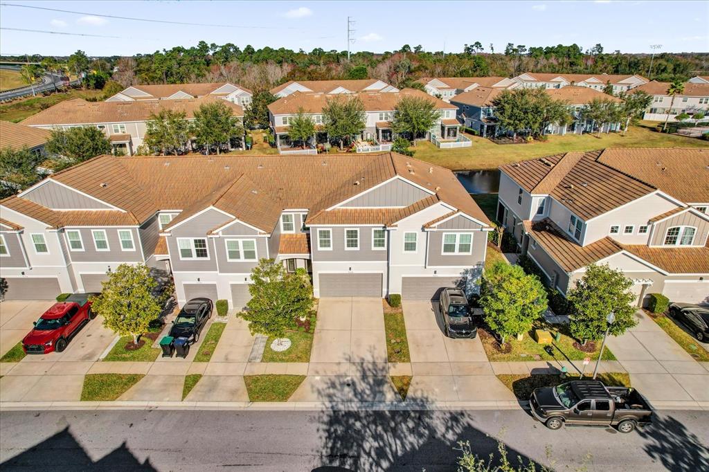 9084 Shepton Street Orlando, FL 32825 - Photo 2 of 26 an aerial view of a houses with a yard