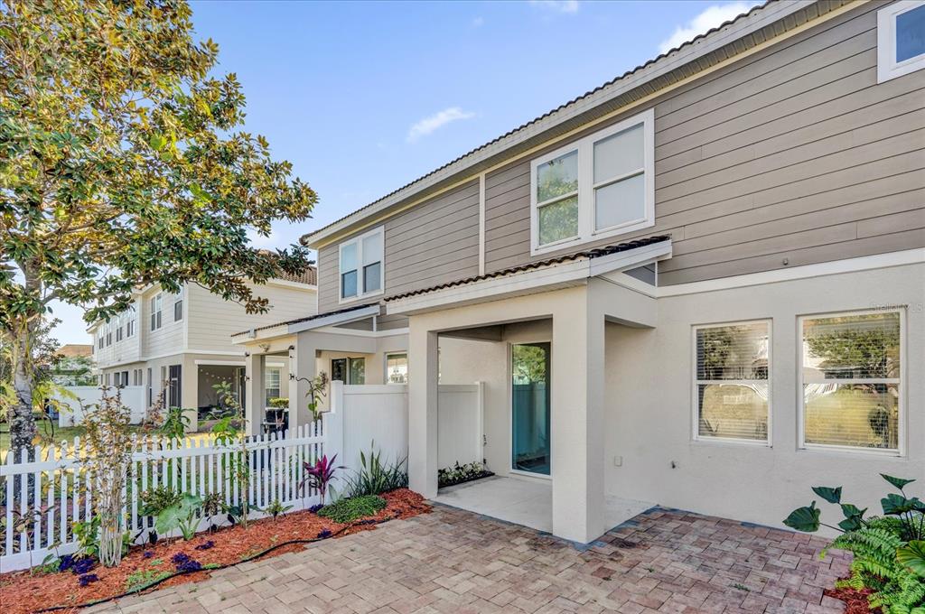 9084 Shepton Street Orlando, FL 32825 - Photo 25 of 26 a front view of a house with a porch