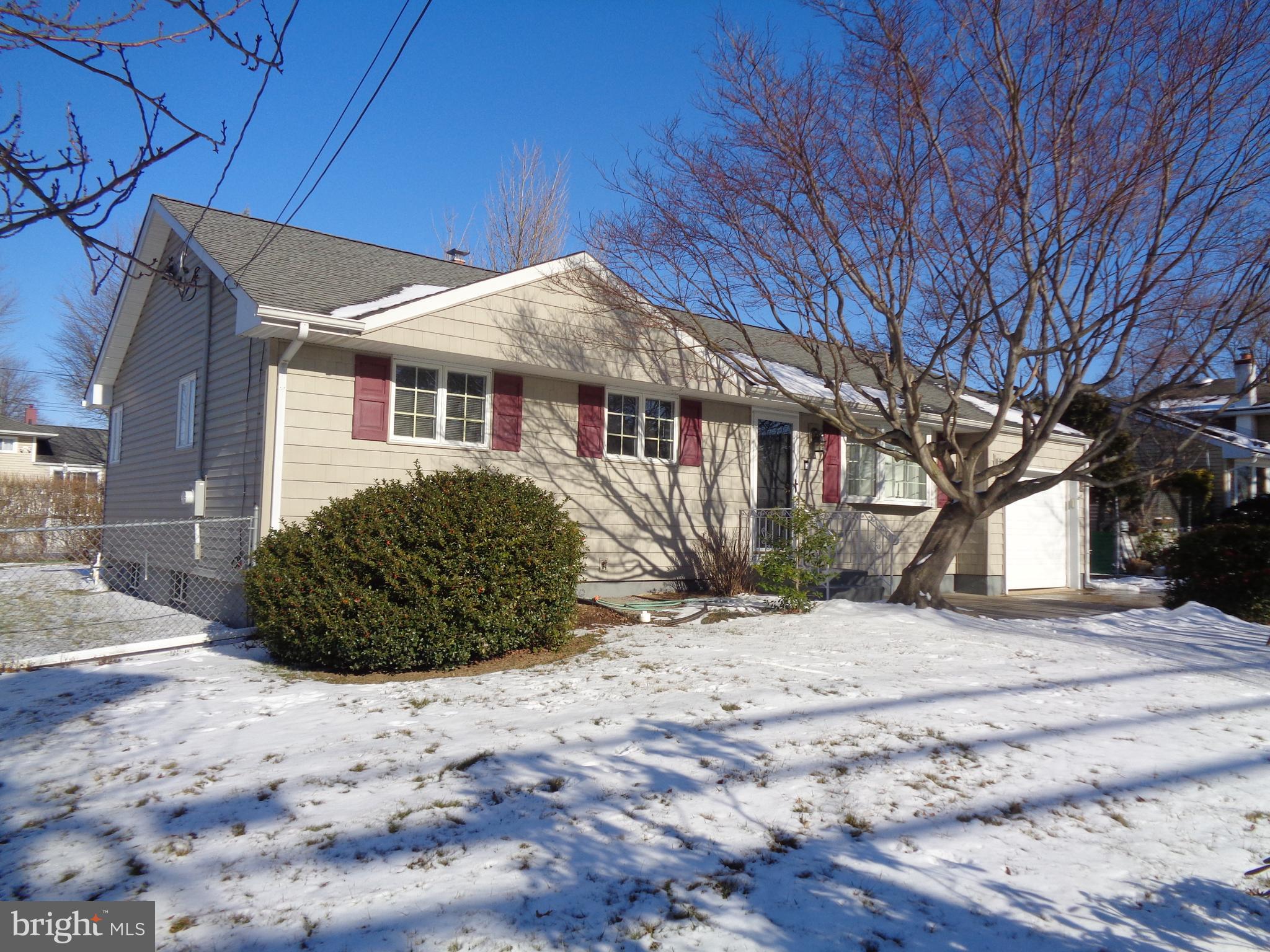 a view of a house with a snow in the yard