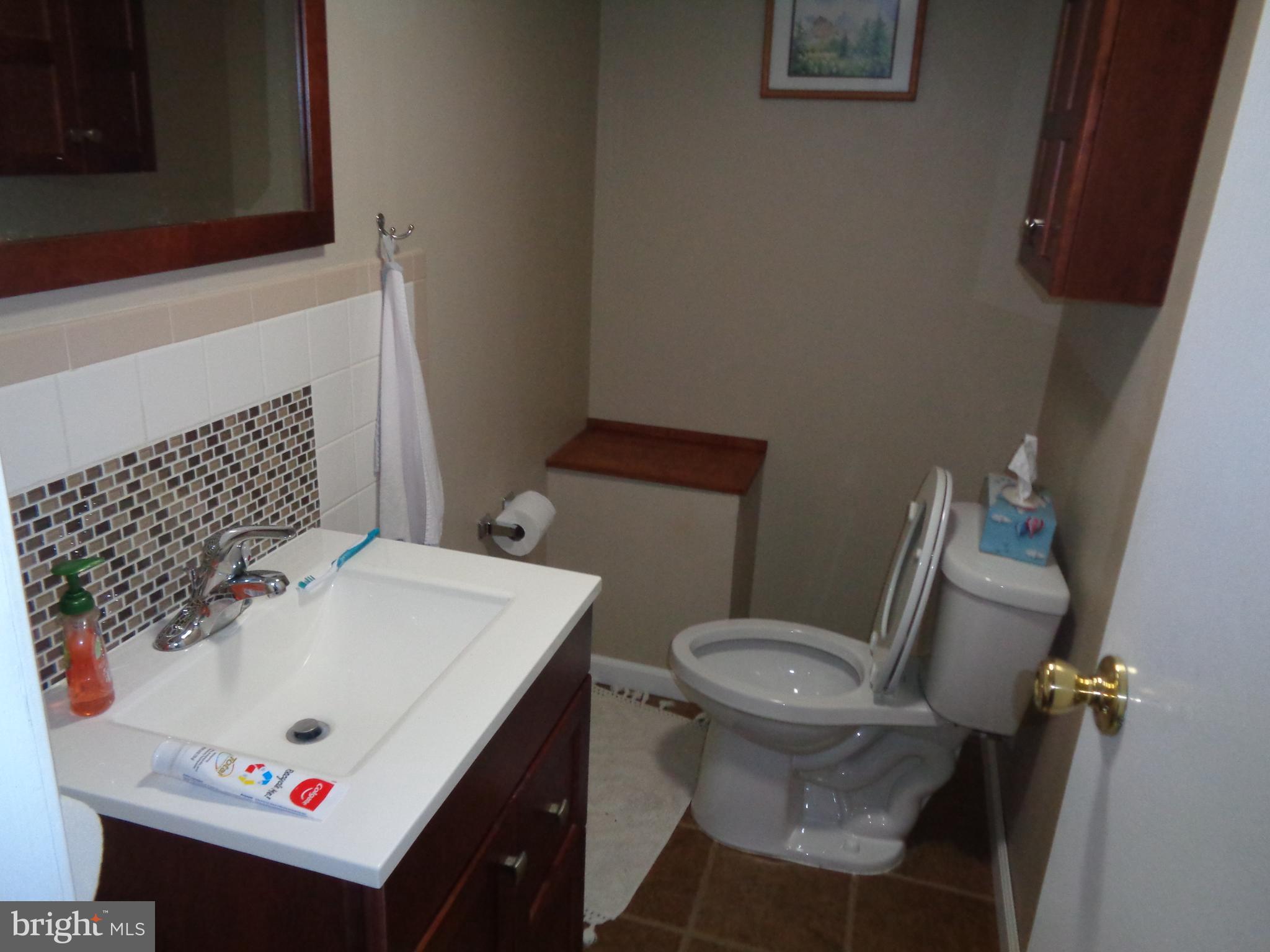 2380 Klockner Road Hamilton, NJ 08690 - Photo 11 of 21 a bathroom with a sink and a toilet