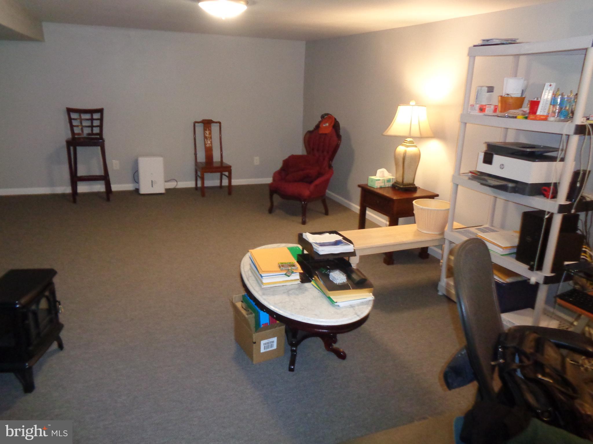 2380 Klockner Road Hamilton, NJ 08690 - Photo 13 of 21 a living room with furniture and a lamp