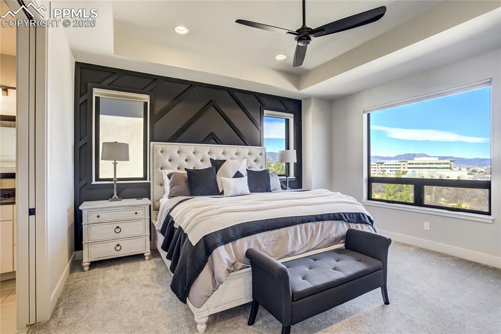12284 Monarchos Lane Colorado Springs, CO 80921 - Photo 17 of 50 a bedroom with a bed a window and a couch