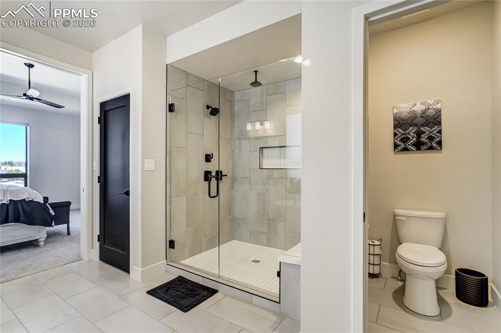 12284 Monarchos Lane Colorado Springs, CO 80921 - Photo 20 of 50 a bathroom with a toilet a sink and shower