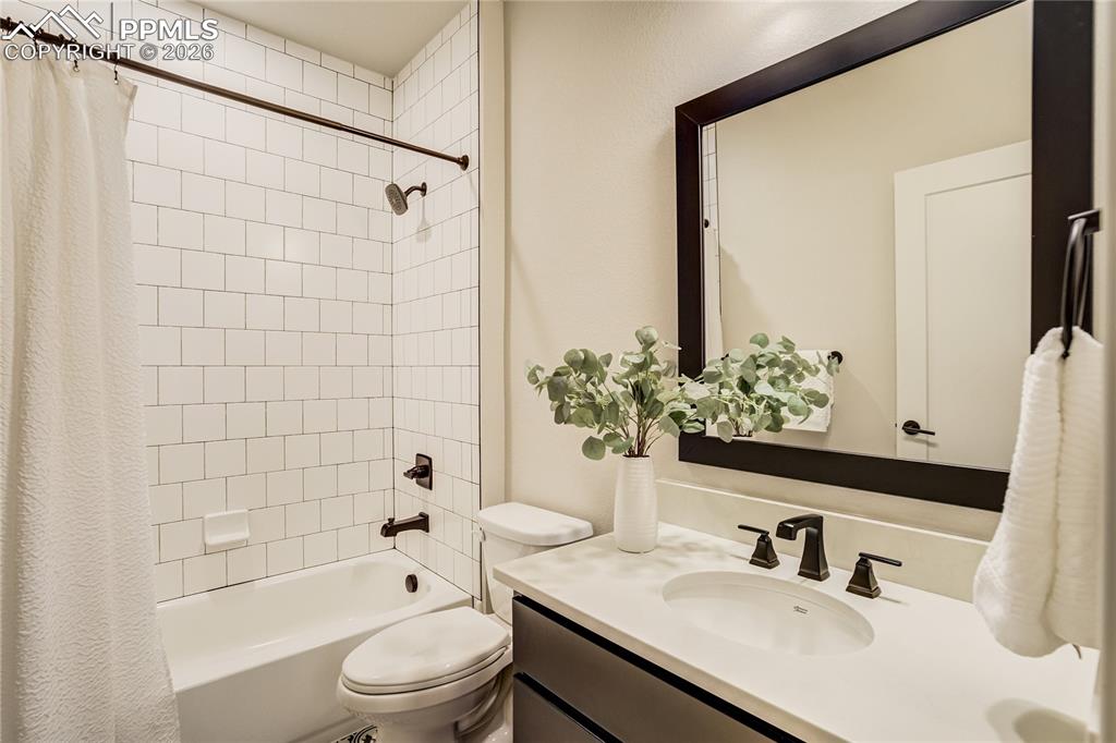 12284 Monarchos Lane Colorado Springs, CO 80921 - Photo 38 of 50 a bathroom with a sink a toilet and shower