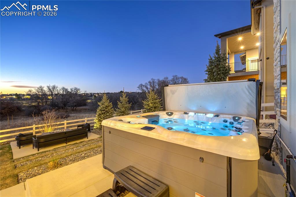 12284 Monarchos Lane Colorado Springs, CO 80921 - Photo 43 of 50 a view of a swimming pool with a lounge chairs