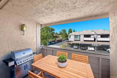 a living room with furniture and a dining table