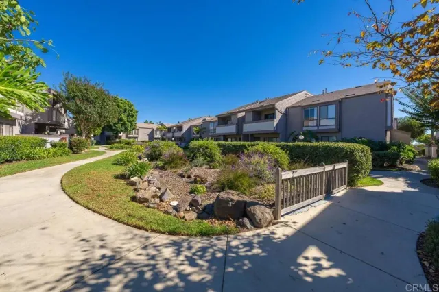 a view of a chairs and table in the garden