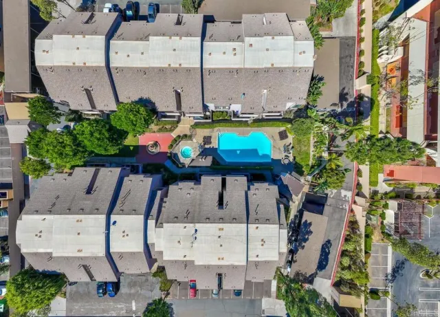 an aerial view of a house with a swimming pool