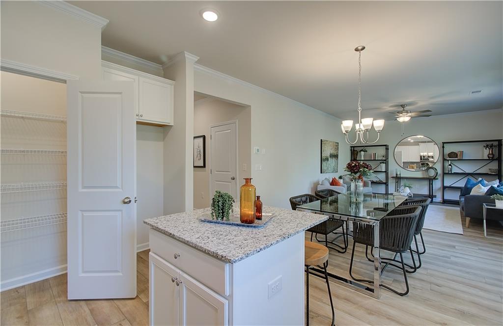 4581 Ajo Walk Atlanta, GA 30331 - Photo 11 of 19 a kitchen with a table and chairs in it