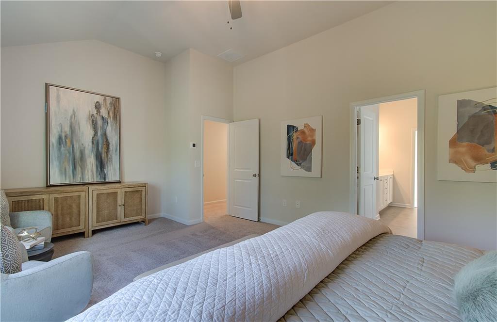 4581 Ajo Walk Atlanta, GA 30331 - Photo 15 of 19 a bedroom with a bed and a dresser