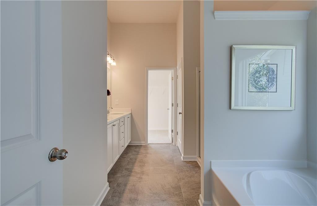 4581 Ajo Walk Atlanta, GA 30331 - Photo 16 of 19 a bathroom with a tub and shower