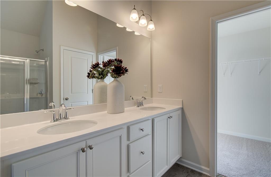 4581 Ajo Walk Atlanta, GA 30331 - Photo 18 of 19 a bathroom with a sink vanity and a mirror