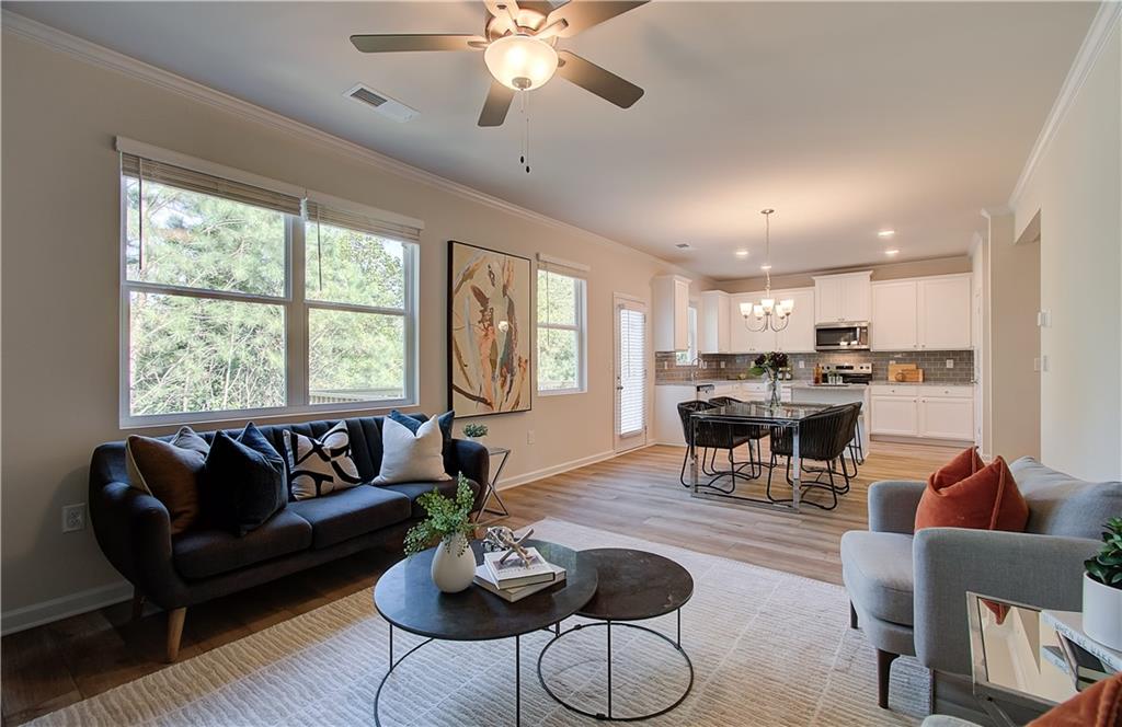 4581 Ajo Walk Atlanta, GA 30331 - Photo 3 of 19 a living room with furniture kitchen area and a large window