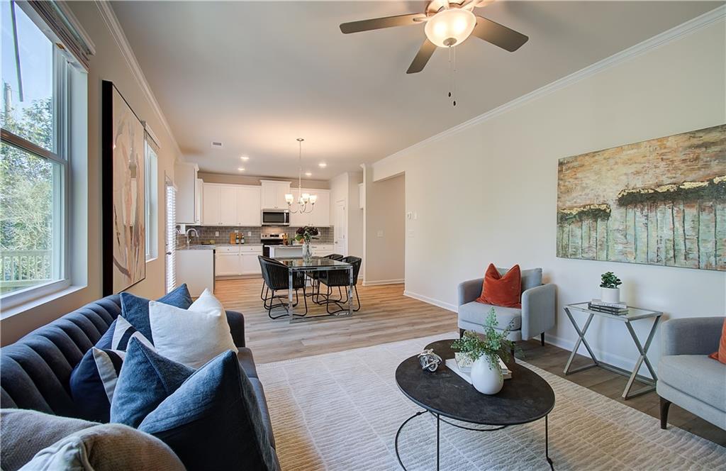 4581 Ajo Walk Atlanta, GA 30331 - Photo 4 of 19 a living room with furniture kitchen view and a large window