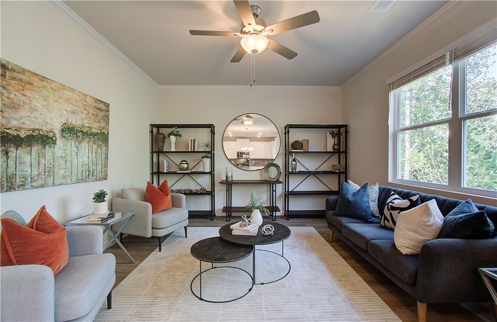 4581 Ajo Walk Atlanta, GA 30331 - Photo 5 of 19 a living room with furniture a rug potted plant and a large window