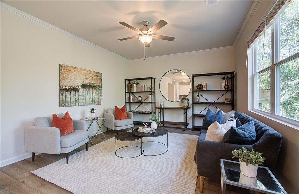 4581 Ajo Walk Atlanta, GA 30331 - Photo 7 of 19 a living room with furniture and a large window