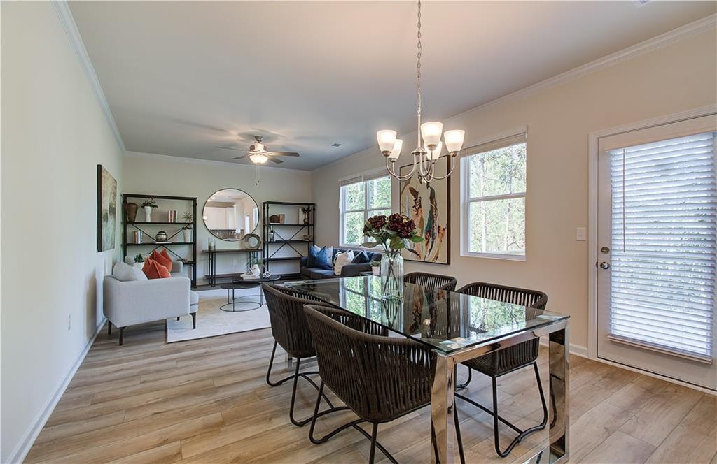 4581 Ajo Walk Atlanta, GA 30331 - Photo 9 of 19 a view of a dining room with furniture and wooden floor