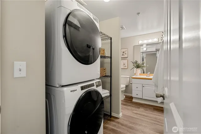 a view of a bedroom with washer and dryer