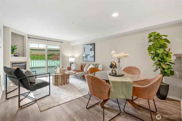 a view of a livingroom with furniture and a window